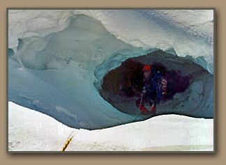 Tom Foster explores Mt. Rainier summit crater steam vents.